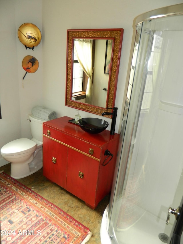 601 N Berry Ave, Winslow, AZ 86047 - bathroom featuring walk in shower, toilet, and vanity
