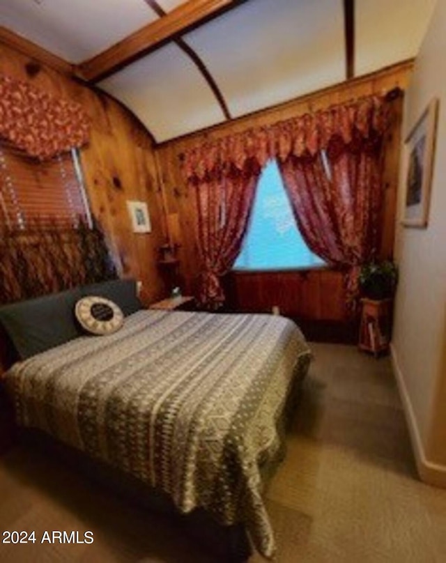 601 N Berry Ave, Winslow, AZ 86047 - bedroom with lofted ceiling, wood walls, and carpet floors