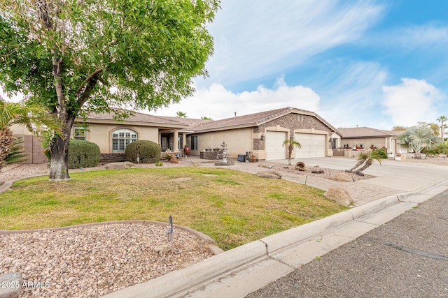 ranch-style house featuring a front yard, concrete driveway, an attached garage, and stucco siding