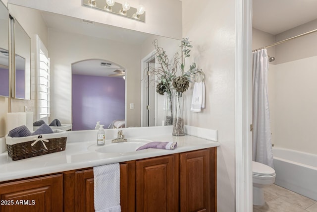 ensuite bathroom with visible vents, connected bathroom, toilet, tile patterned flooring, and vanity