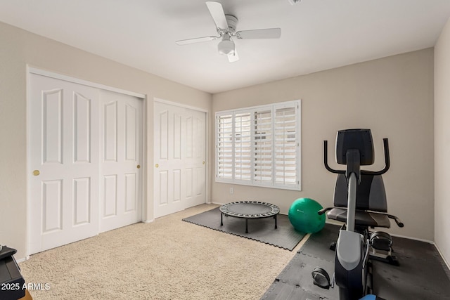 exercise room with ceiling fan