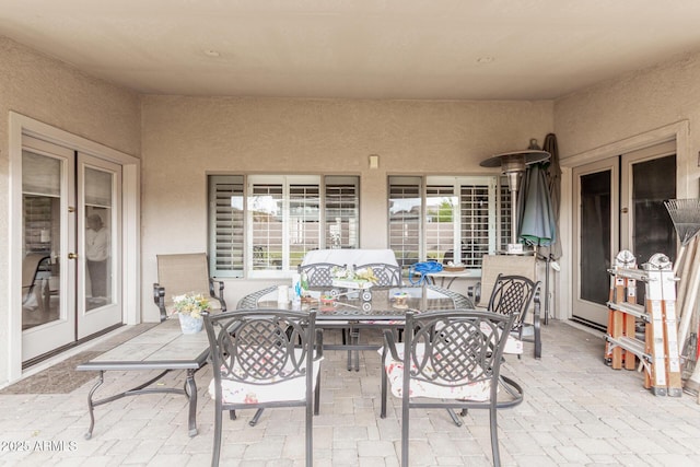 view of patio with outdoor dining space and french doors