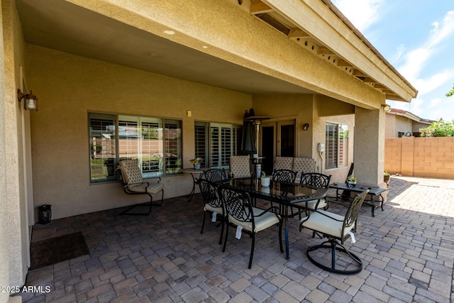 view of patio / terrace featuring fence and outdoor dining space