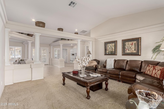 living room with light carpet, ornate columns, visible vents, and vaulted ceiling