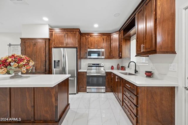 kitchen with appliances with stainless steel finishes and sink