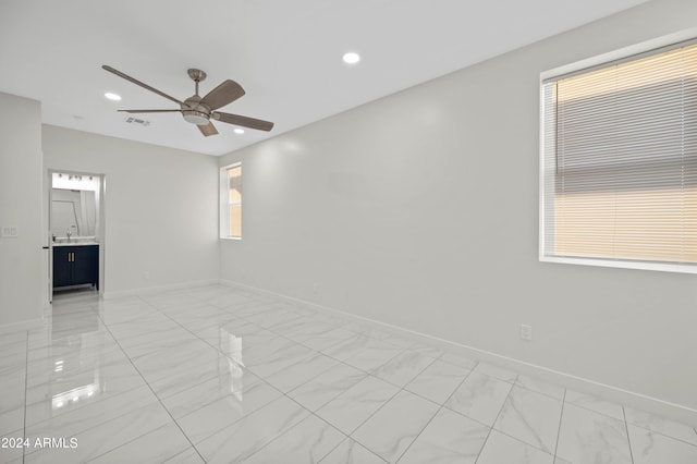 unfurnished room with ceiling fan