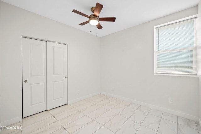 unfurnished room with ceiling fan