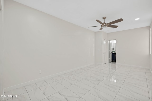 spare room with ceiling fan