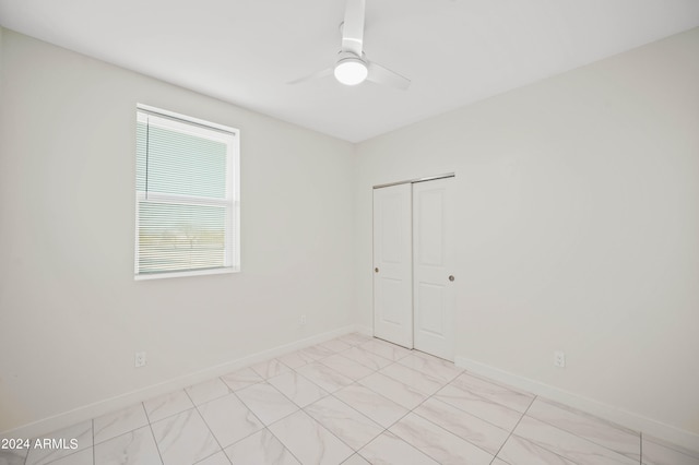 unfurnished room featuring ceiling fan