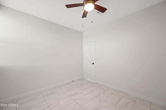 spare room with ceiling fan