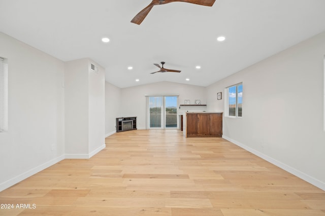 unfurnished living room featuring lofted ceiling, light hardwood / wood-style flooring, and ceiling fan