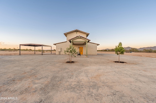 view of front of house featuring a mountain view and a carport