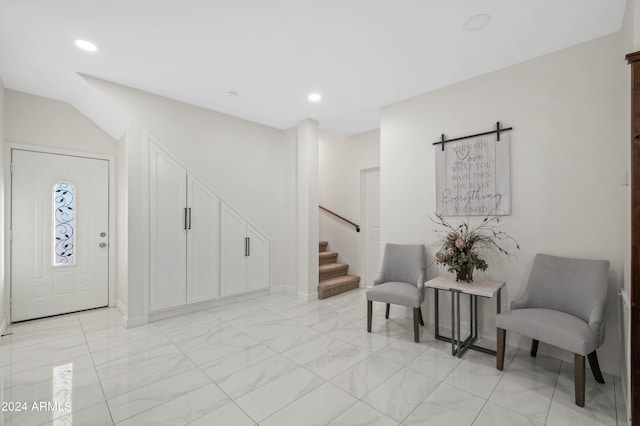 foyer featuring a barn door