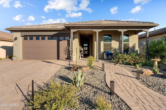 prairie-style house featuring a garage