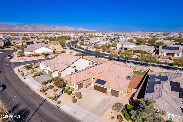 birds eye view of property with a mountain view