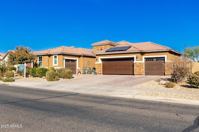 view of front of house featuring solar panels