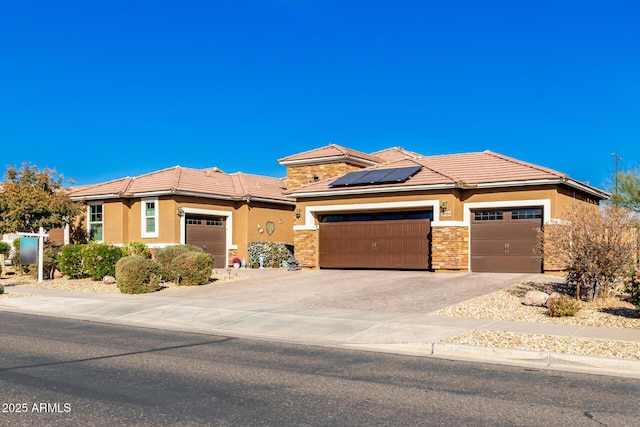 view of front of home featuring solar panels