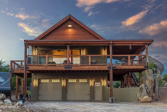 view of front facade featuring a garage and a deck