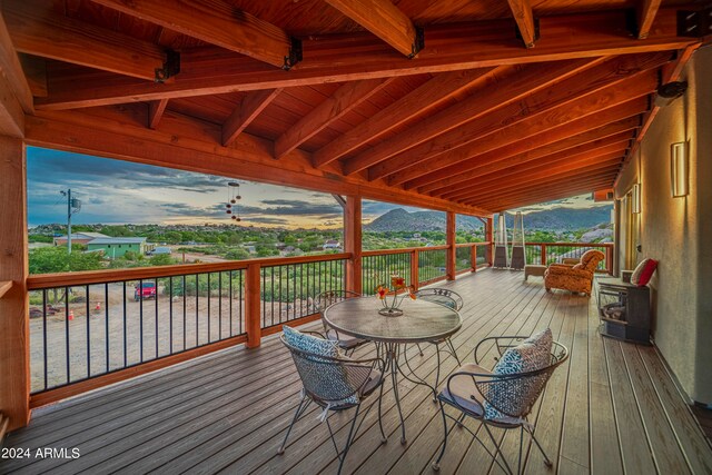 wooden deck with a mountain view