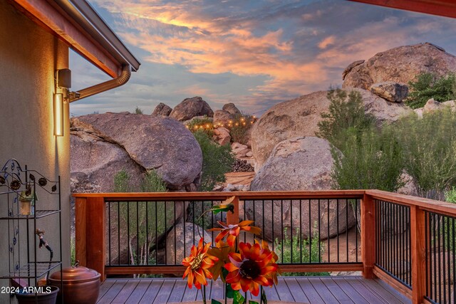 deck at dusk with a mountain view