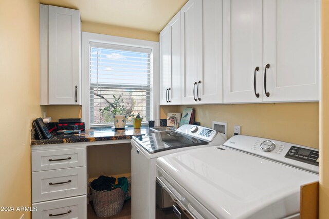 laundry area featuring cabinets and washer and dryer