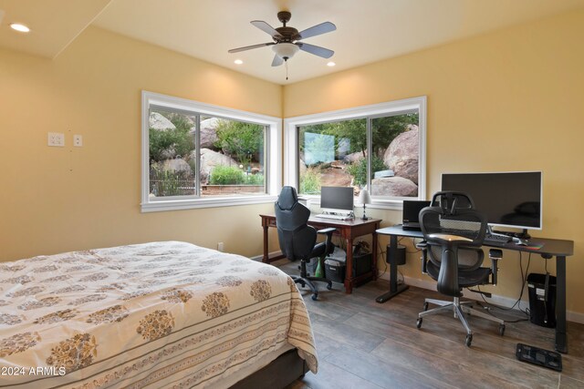 bedroom with hardwood / wood-style flooring and ceiling fan