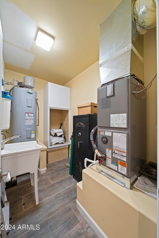 utilities featuring sink and water heater