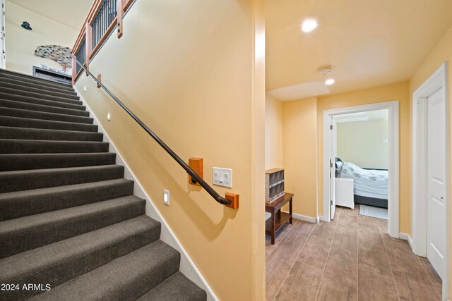 staircase featuring hardwood / wood-style floors