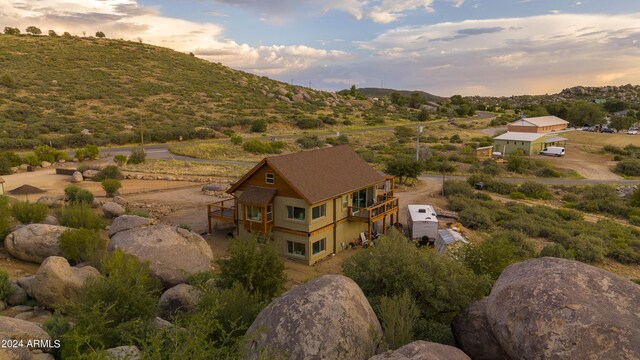 view of front of house with a garage and a deck