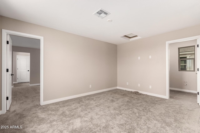 15599 S 180th Ln, Goodyear, AZ 85338 - carpeted spare room with baseboards and attic access