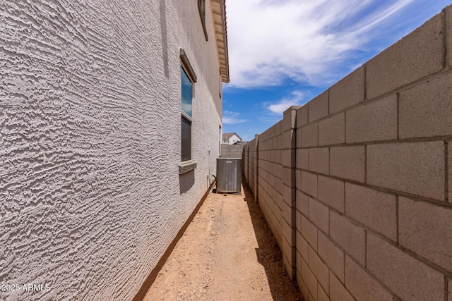 15599 S 180th Ln, Goodyear, AZ 85338 - view of side of home with stucco siding and central air condition unit