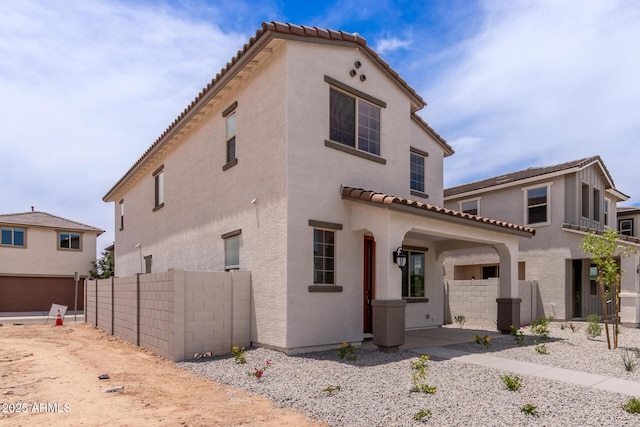 15599 S 180th Ln, Goodyear, AZ 85338 - view of front facade featuring stucco siding, a tile roof, and a garage