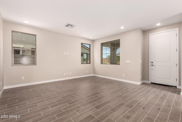 15599 S 180th Ln, Goodyear, AZ 85338 - unfurnished room featuring baseboards, dark wood-type flooring, and recessed lighting