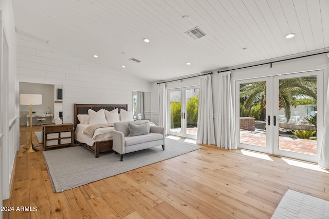 bedroom with wood ceiling, vaulted ceiling, access to exterior, light hardwood / wood-style flooring, and french doors