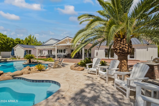 view of pool featuring a patio area