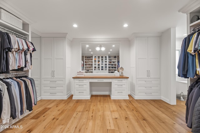 walk in closet featuring light hardwood / wood-style flooring