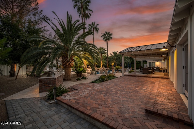 view of patio terrace at dusk