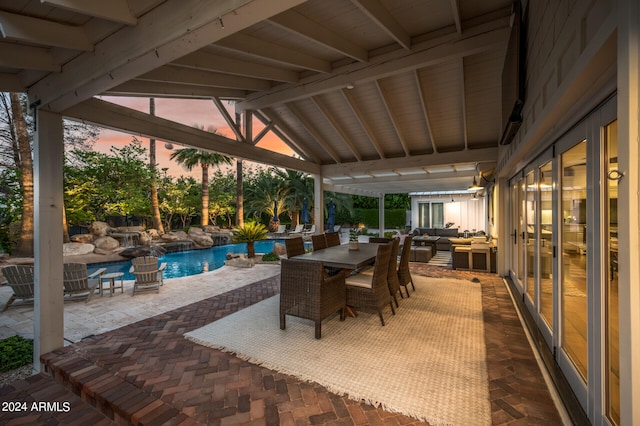 patio terrace at dusk with an outdoor living space