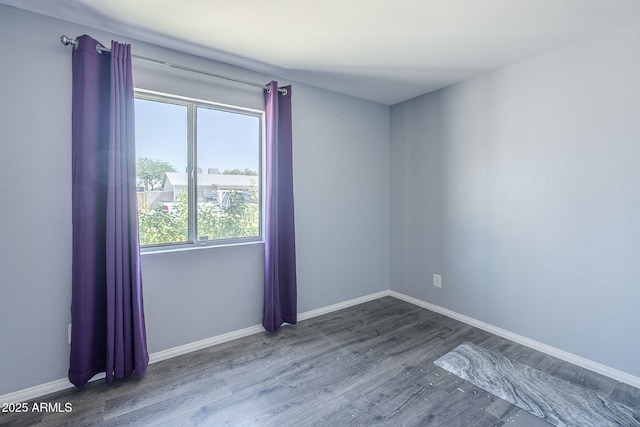 4025 E Surrey Ave, Phoenix, AZ 85032 - empty room featuring wood finished floors and baseboards