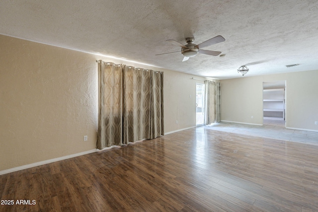 4025 E Surrey Ave, Phoenix, AZ 85032 - unfurnished room with ceiling fan, a textured ceiling, wood finished floors, baseboards, and a textured wall