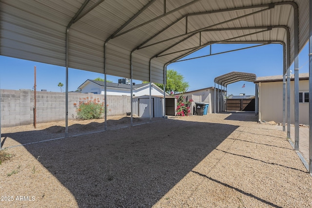 4025 E Surrey Ave, Phoenix, AZ 85032 - view of parking featuring a storage unit and a detached carport