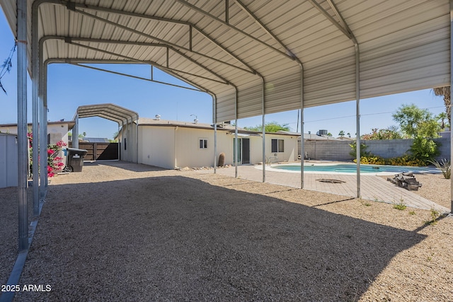 4025 E Surrey Ave, Phoenix, AZ 85032 - view of car parking with a fenced backyard and a carport