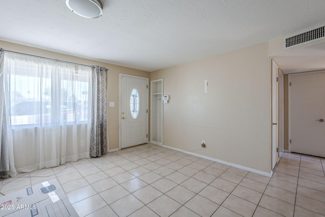 4025 E Surrey Ave, Phoenix, AZ 85032 - foyer entrance featuring baseboards and light tile patterned floors