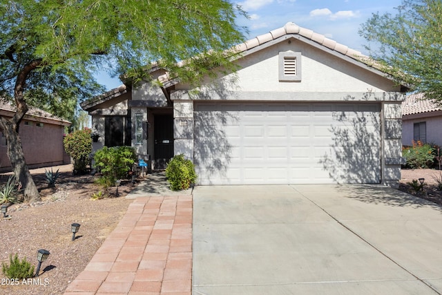 3534 N 106th Ln, Avondale, AZ 85392 - view of front of property with a garage, driveway, stucco siding, and a tile roof