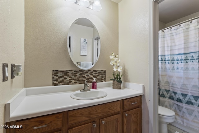 3534 N 106th Ln, Avondale, AZ 85392 - bathroom with vanity, backsplash, and a shower with shower curtain