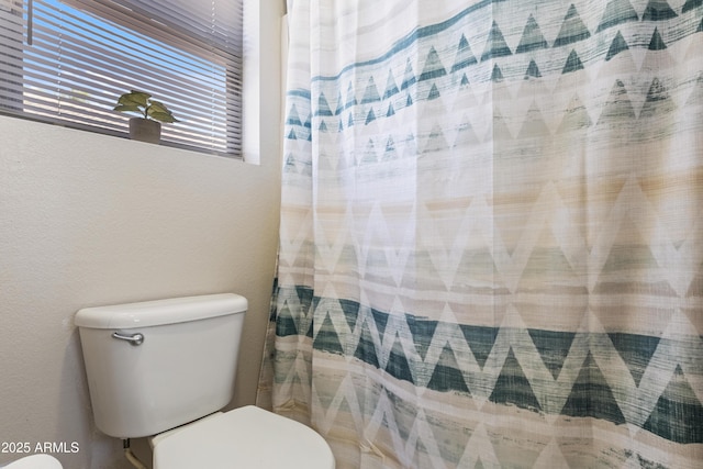 3534 N 106th Ln, Avondale, AZ 85392 - bathroom with toilet and a shower with curtain