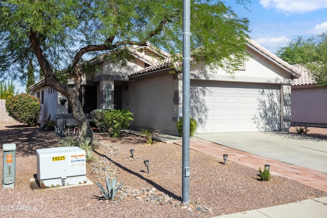 3534 N 106th Ln, Avondale, AZ 85392 - view of front of property with a tile roof, stucco siding, concrete driveway, and a garage