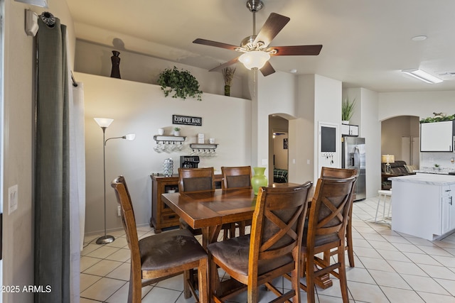 3534 N 106th Ln, Avondale, AZ 85392 - dining space featuring arched walkways, light tile patterned floors, and ceiling fan