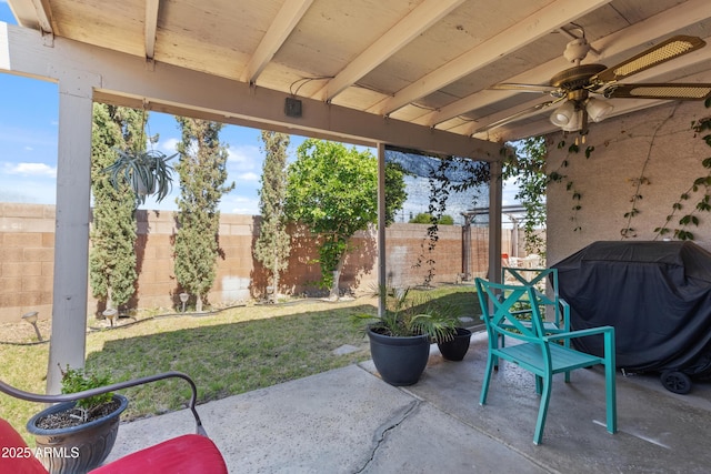 3534 N 106th Ln, Avondale, AZ 85392 - fenced backyard with a ceiling fan, grilling area, and a patio area