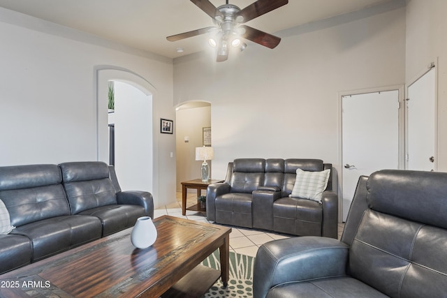 3534 N 106th Ln, Avondale, AZ 85392 - living area with arched walkways, a ceiling fan, and light tile patterned flooring
